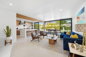 A modern living space with a kitchen, dining area, and seating area. - Casa Roka - Luxury 4 Bedroom Palm Springs Retreat with Private Pool and Hot Tub (Palm Springs)
