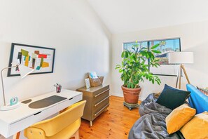 A room with a desk, chair, bed, potted plant, and a window with blinds. - Dreamville Palm Springs by Oranj Palm (Palm Springs)