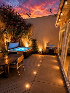 A patio with a hot tub, a grill, and a table with chairs. - 2BR coastal San Diego home near the pier (San Diego)