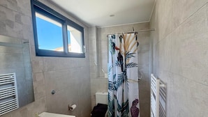 A modern bathroom with a large sink, a toilet, and a shower area. - MAS DE L'OLIVERAIE (Grans)