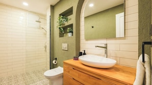 A bathroom with a shower, toilet, vanity, and a large mirror. - Modern, 3BR, Best Location (Kadıköy)