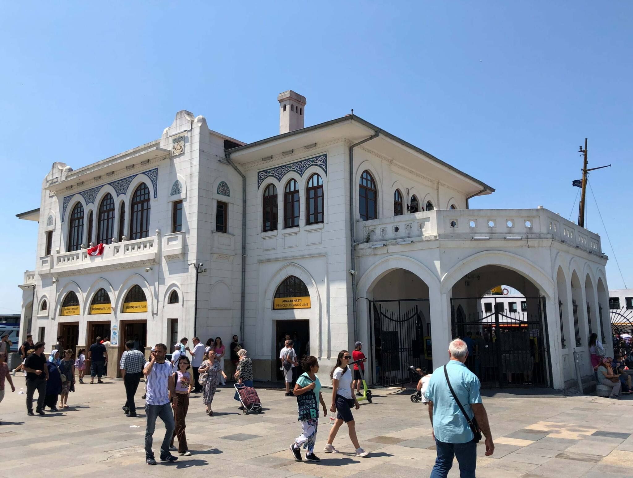 A historic building with multiple arches and a prominent clock tower.