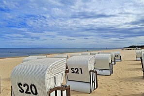 Beach chairs with price tags on a sandy beach. - House at Buchenpark 11 (Heringsdorf (Seebad))