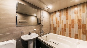 A modern bathroom with a bathtub, a sink, and a shower. - KOZAZA (Changwon-si)