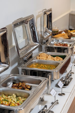 A buffet with various food options including a salad, rice, and different types of bread. - Hotel Superior Inn (Kathmandu)