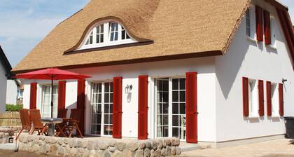 A Stunning Thatched-Roof Vacation Home by the Coastal Forest with a Terrace and Garden