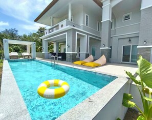 A modern two-story house with a swimming pool, outdoor seating, and a covered patio area. - Panoramic Sunset View Private Pool Villa, Maikhao beach (Thalang)