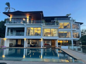 A multi-story modern house with a swimming pool in front. - Smith & Appy Luxury Seaview Penthouse (Koh Samui)