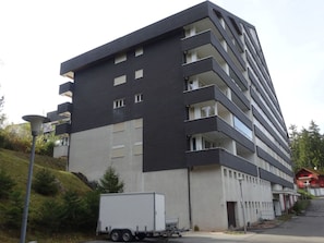 A multi-story building with balconies and a flat facade. - Apartmenthaus Gauenpark (CharmingStay), (Flumserberg Tannenheim), by Interhome (Flumserberg Tannenheim)