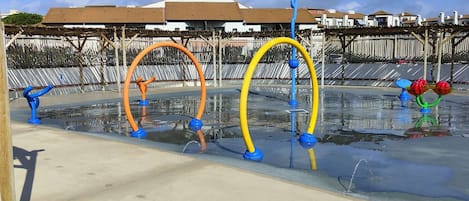 A water play area with colorful structures.