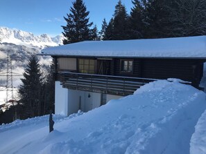 A cabin with a balcony, surrounded by snow and mountains. - Chalet Schwendihus (CharmingStay), (Flumserberg Tannenbodenalp), by Interhome (Mols)