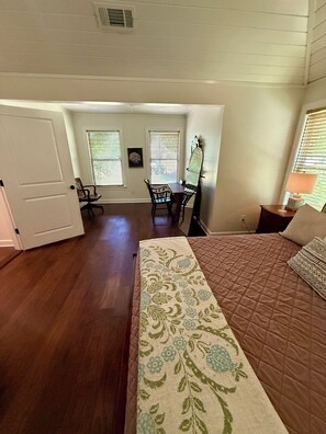 A bedroom with a bed, a desk, and a chair. There is a door leading to another room. - Oxford at its Best! Location, Layout, Privacy!! (Oxford)