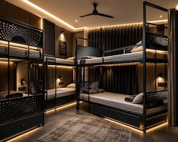 A bunk bed room with a ceiling fan, a framed motivational quote, and a patterned rug.