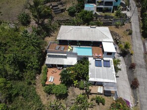 A modern house with a swimming pool, multiple decks, and a large garden. - Villa Coco Prestige - Three Bedroom Villa, Sleeps 6 (Les Trois-Îlets)