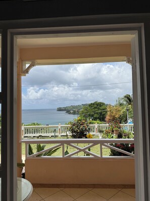 A balcony with a view of the sea and a white fence. - Belle Escape - Blue Room (Castries)