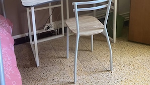 A small room with a white metal desk, a white chair, a white microwave, a coffee maker, a map on the wall, and a lamp. - Vrbo Property (Caudiès-de-Fenouillèdes)