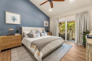 A bedroom with a bed, bedside tables, a ceiling fan, and a view through a sliding glass door. - Luxe 3BR 3BA Condo 2 min walk to Lake & Loop Trail 4mi Hosp 10mi Beach 6mi Irv (Mission Viejo)