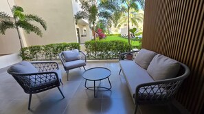 A patio with a sofa, two chairs, and a small table. - A magnificent oasis of peace just a few minutes from Bavaro Beach (Punta Cana)