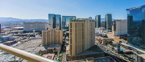 A cityscape with modern high-rise buildings, including a prominent hotel with a visible sign.