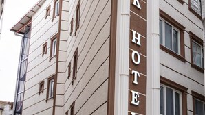 A multi-story hotel with a prominent sign reading 'Bursa Konak Hotel.' - Bursa Konak Hotel (Bursa)