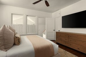 Ein Schlafzimmer mit einem Bett, einem Schminktisch, einem Fernseher und einem Fenster mit Fensterläden.