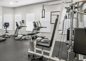 A gym with cardio machines, weightlifting equipment, and exercise mats. - Paradise awaits! Straight shot to the beach! Close to all Naples has to offer! (Naples)