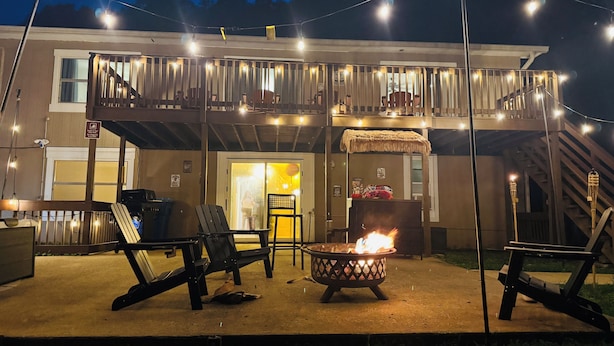 A building with a balcony, outdoor seating, and a fire pit. - River Bend Reserve (Frankfort)