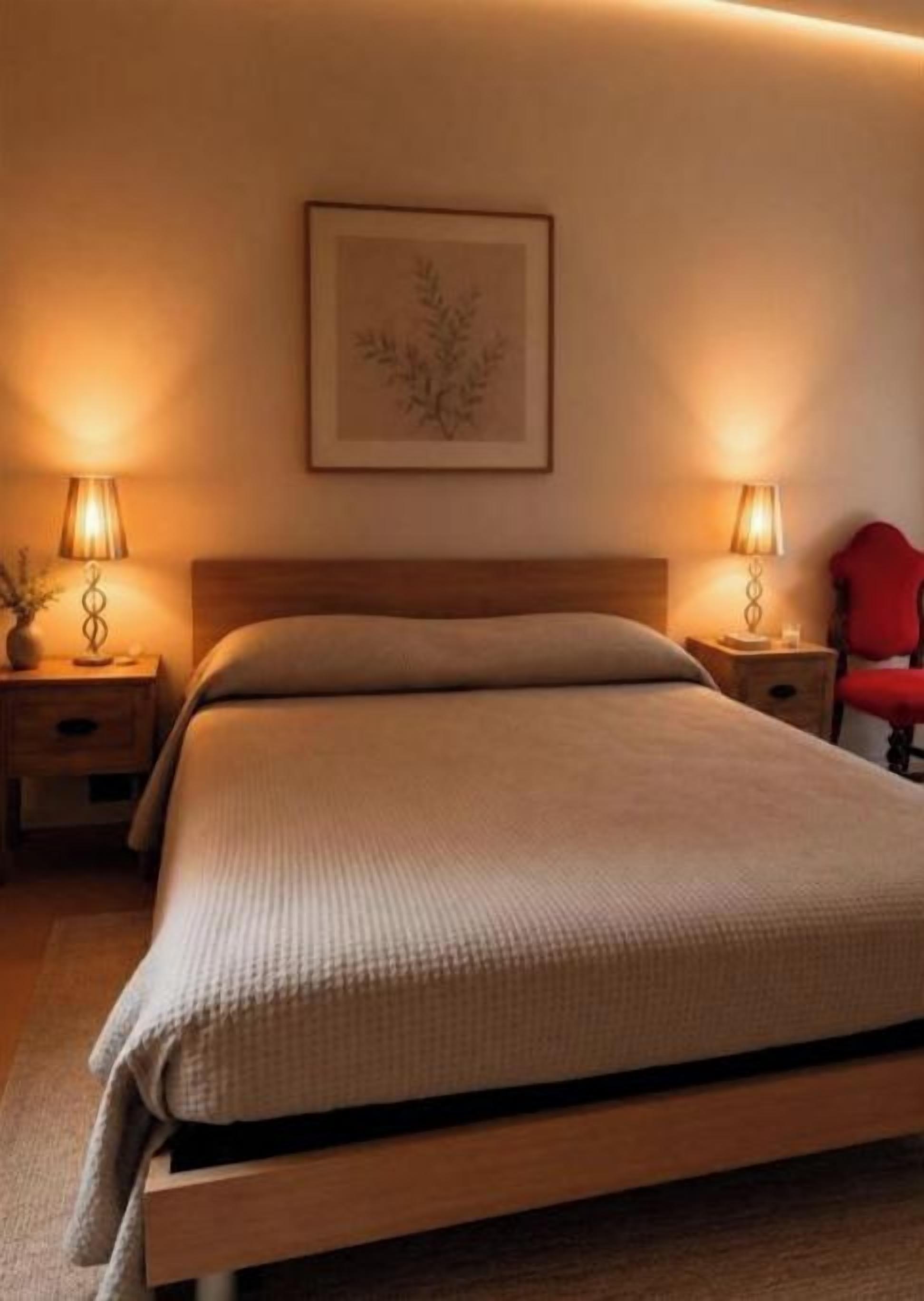 A single bed with a wooden frame, two bedside tables with lamps, and a framed artwork on the wall.