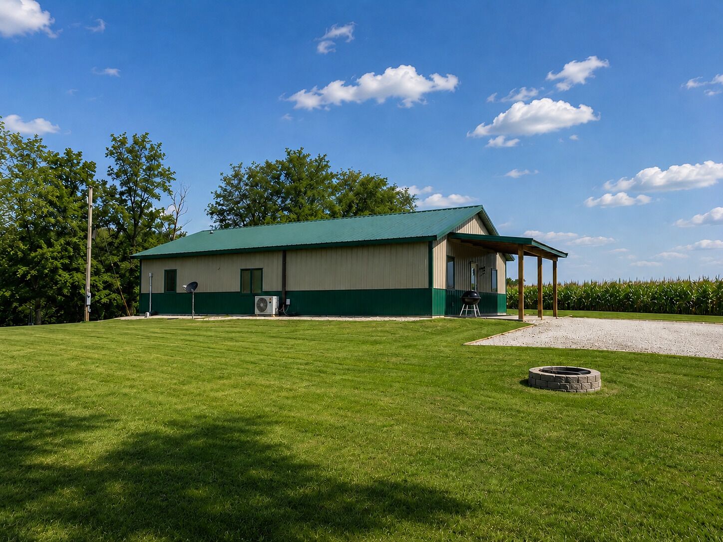 A building with a green roof and a covered outdoor area.