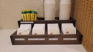 A tea display with four labeled boxes: Barley tea, Solomon's seal tea, Green tea, and Buckwheat tea. - Olimstay Jamsil (Seoul)