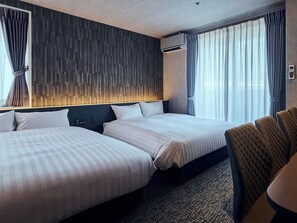 A hotel room with two beds, a headboard, a bedside table, a chair, and a window with curtains. - HOTEL SOVA Kumamoto Ekimae (Kumamotoshi)