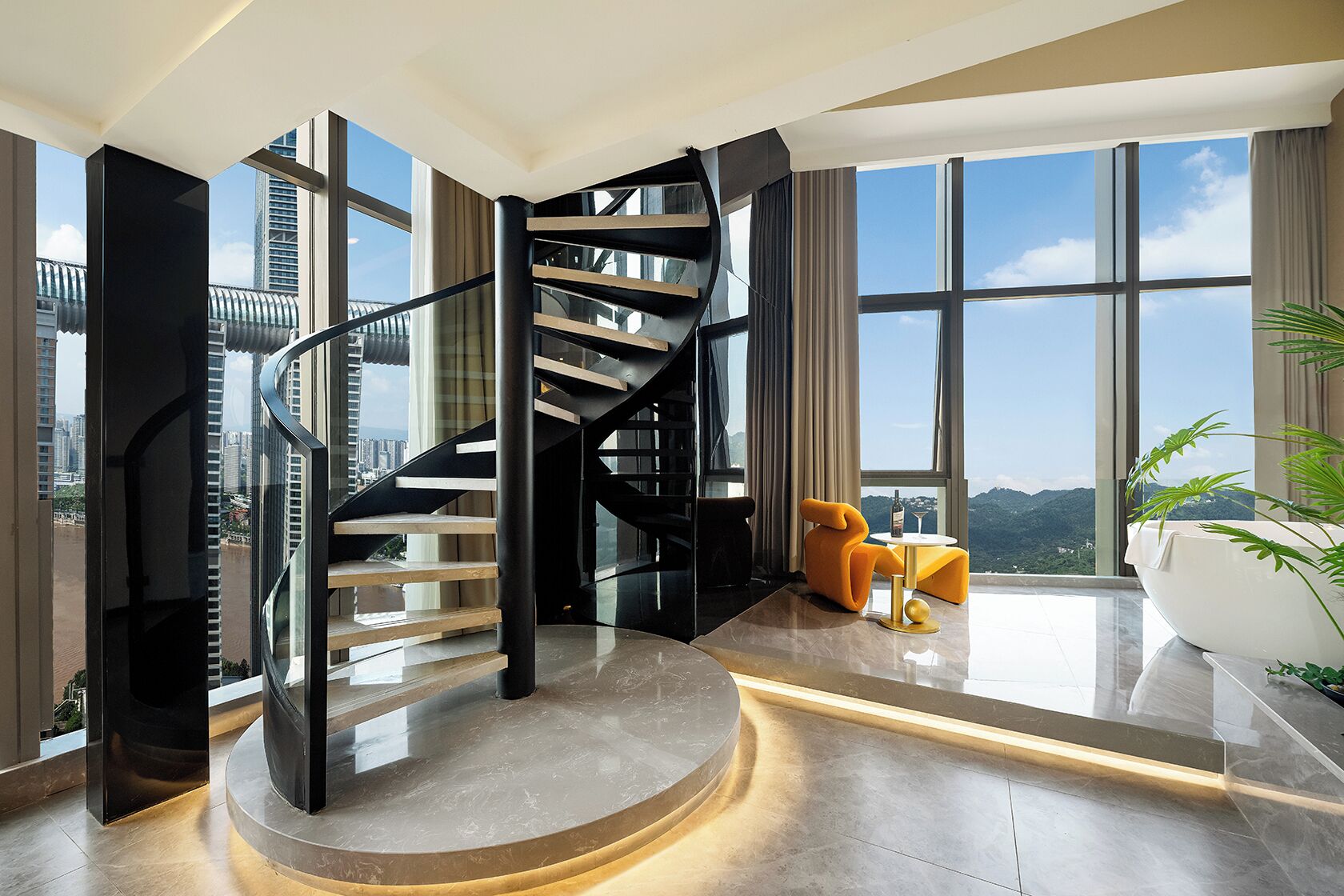 A modern interior with a spiral staircase, large windows, and a view of the cityscape.