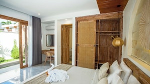 A modern bedroom with a large bed, a desk, and a view of the outdoors. - Ubud 2BR Villa Private Pool Abhimanyu (Ubud)