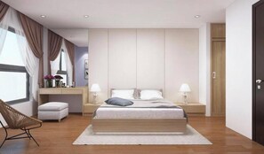 Un dormitorio moderno con una cama grande, mesitas de noche, un escritorio y una silla.