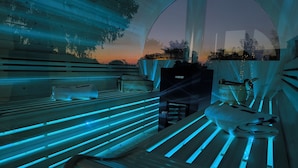 A sauna with wooden benches and a bench with a towel. - Vrbo Property (Allstedt)