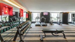 A gym with treadmills, dumbbells, and exercise equipment. - The Mulian Hotel (ChengDu)