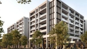 A multi-story building with balconies, a central entrance, and surrounding trees. - The Eastbourne Premium 2BR Central Canberra (Parkes)