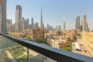 A high-rise building with a modern design, surrounded by other high-rise buildings and a clear sky. - Spacious 2Bedroom+ Maid room with Burj Khalifa View (دبي)