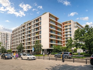 A multi-story residential building with a modern design, featuring balconies and large windows. - Chmielna Duo Luxury | Warsaw Center & Parking (Warszawa)
