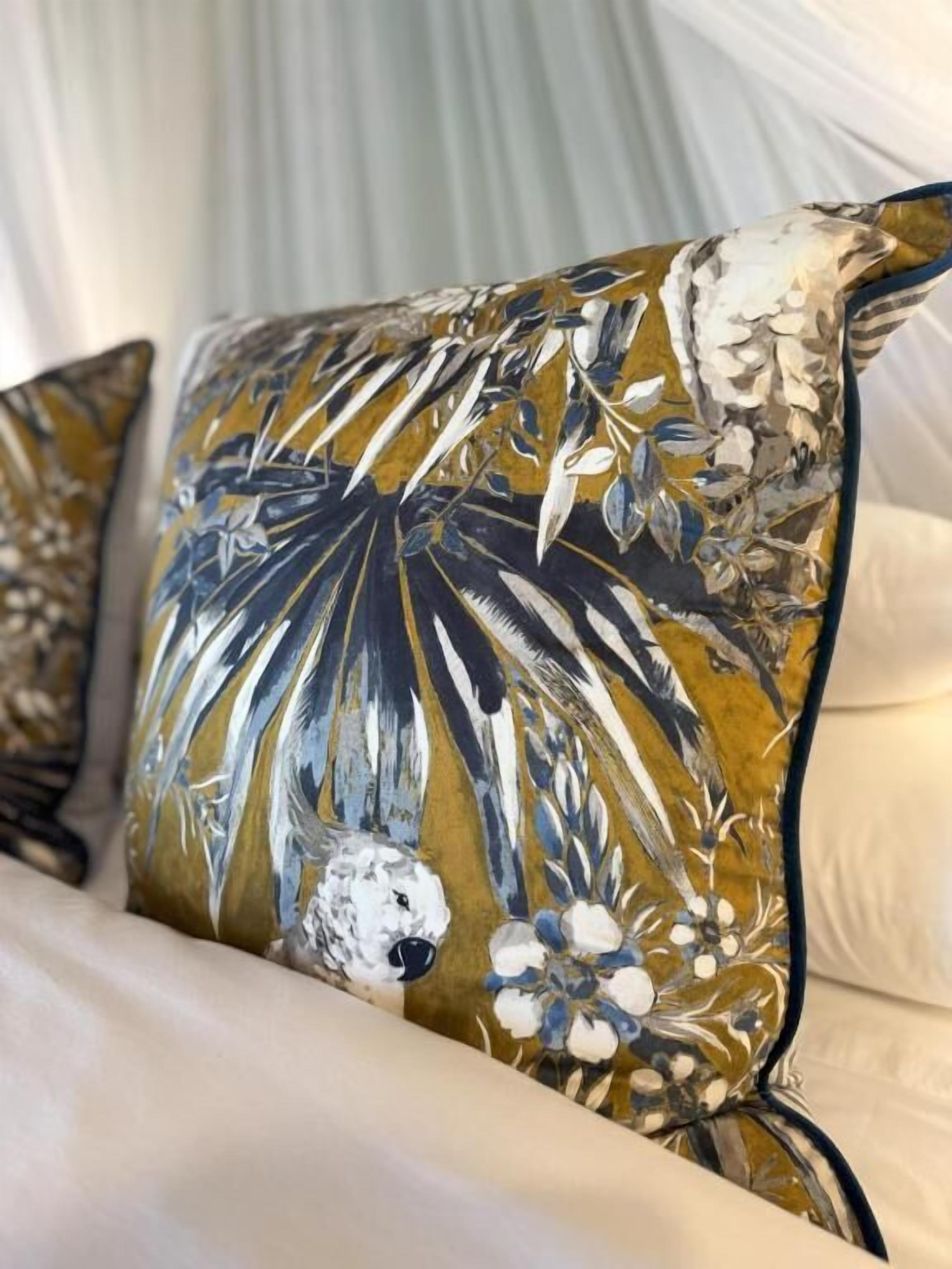 A pillow with a floral pattern.