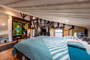 A bedroom with a bed, a desk, and a shelving unit with various items. - Holiday Home 'Domaine Liminalis' with Private Terrace, Garden and Wi-Fi (Saint-Martin-Petit)