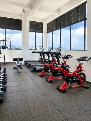 A gym with stationary bikes, treadmills, and dumbbells. - "Beautiful luxurious spacious 2 bedroom 
apartment with amazing amenities..." (Nairobi)