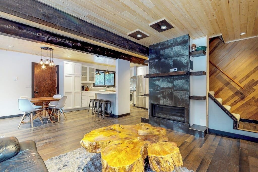 A modern interior with a dining area, kitchen, and living space.