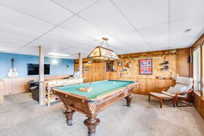 A pool table in a room with wooden walls, a ceiling fan, and a mounted guitar. - Impeccable 3BR Oceanview Dog Friendly - Hot Tub (Port Ludlow)