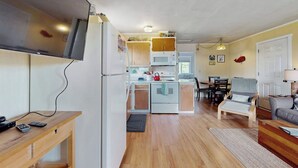 A compact living space with a kitchenette, a dining area, and a seating area. - 2BR Oceanview Dog Friendly | Deck | Fireplace (Moclips)