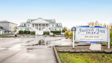 A sign for Judith Ann Inn with a contact number and website.