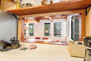 A kitchen with a wooden countertop, a coffee machine, and a knife block. - 4BR - Sauna - WoodStove - Balcony - Firepit - Washer Dryer (Snoqualmie Pass)