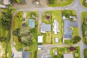 An aerial view of a residential area with houses, roads, and greenery. - 2BR Dog Friendly - Dock - Deck - Foosball - Washer Dryer (Westport)