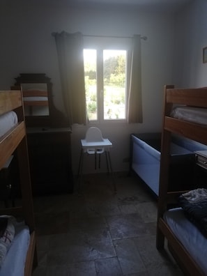 A dormitory room with bunk beds, a desk, and a window. - "Chez Nous" Villa, with Air Conditioning, Pool, BBQ, and Terrace (Grospierres)