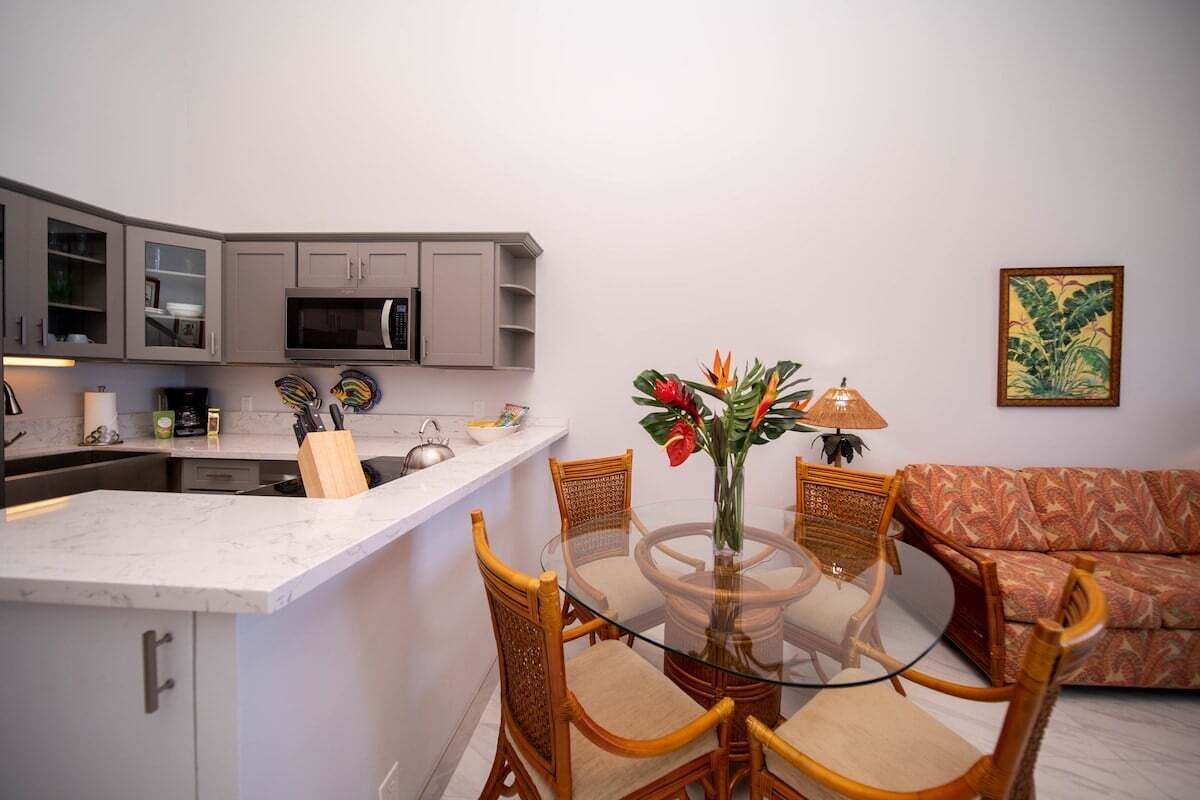 A compact living space with a kitchen, dining area, and seating.